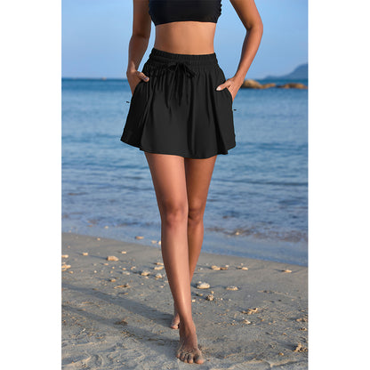 Charmo Women's High Waisted Smocked Drawstring Swim Skirt with Side Zipper Pockets and Built-in Briefs