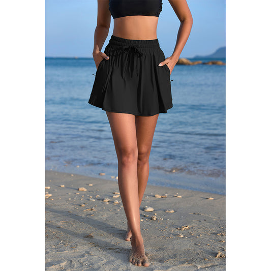 Charmo Women's High Waisted Smocked Drawstring Swim Skirt with Side Zipper Pockets and Built-in Briefs